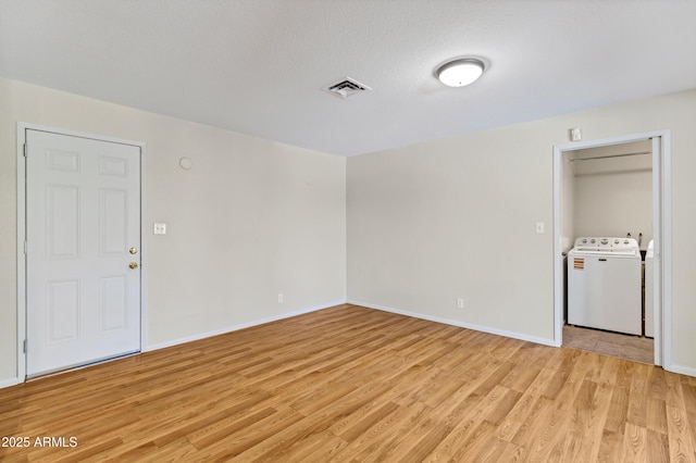 1832 E Concorda Dr, Tempe, AZ 85282 - unfurnished room featuring washer / dryer, light wood-style flooring, and baseboards