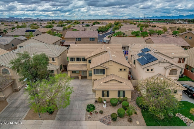 aerial view featuring a mountain view and a residential view