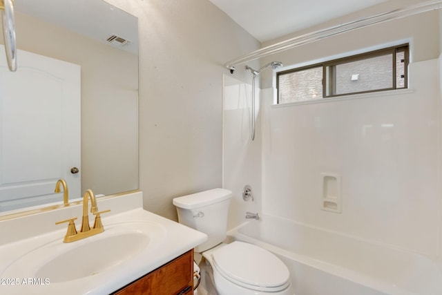 bathroom with vanity, toilet, visible vents, and shower / bathtub combination