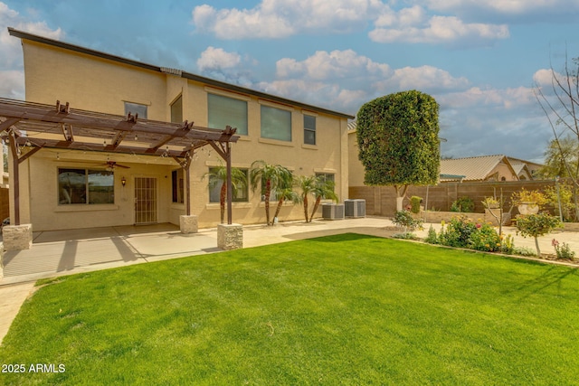 back of house with fence, a pergola, central AC, stucco siding, and a lawn