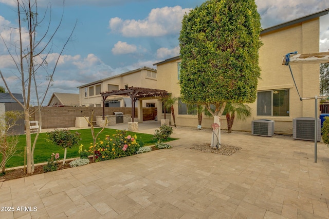 view of patio with fence, a pergola, and central AC