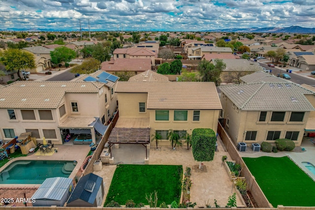 drone / aerial view with a mountain view and a residential view