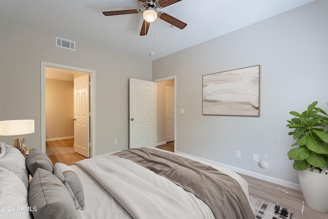 bedroom featuring ceiling fan and light hardwood / wood-style floors