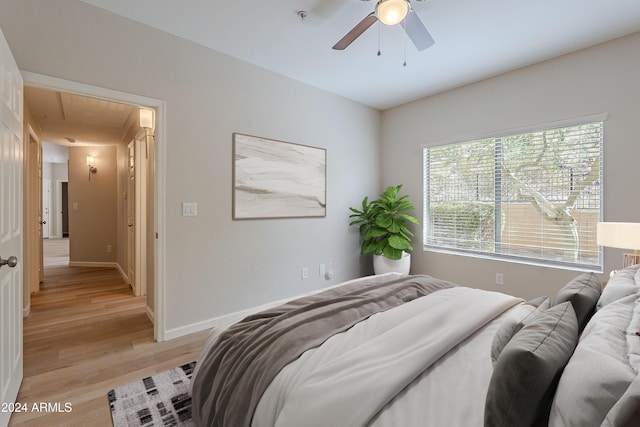 bedroom featuring ceiling fan and light wood-type flooring