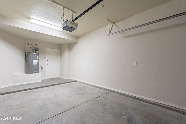 garage with electric water heater and a garage door opener