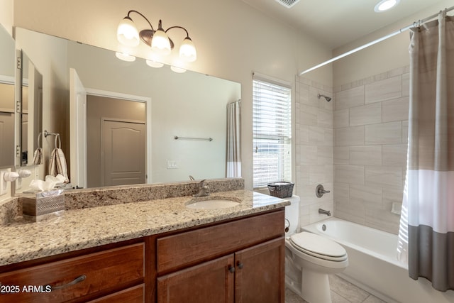 full bathroom featuring tile patterned floors, shower / bathtub combination with curtain, toilet, and vanity