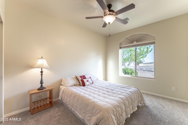 carpeted bedroom with baseboards and visible vents