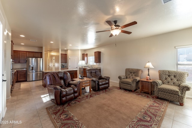living area with light tile patterned floors, baseboards, recessed lighting, and a ceiling fan