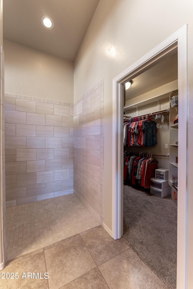 bathroom with a walk in closet