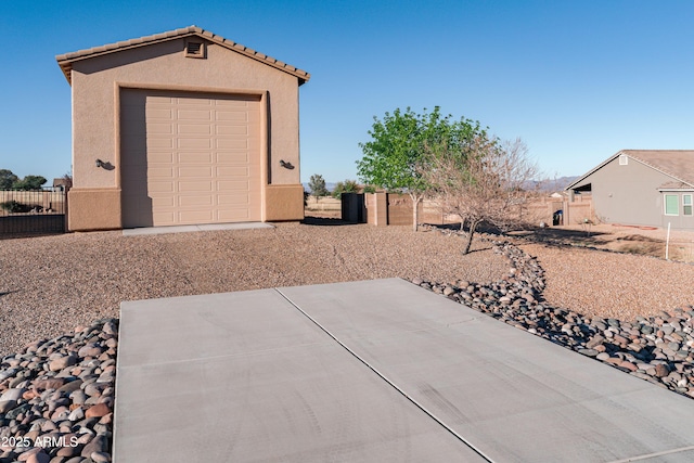 garage featuring fence