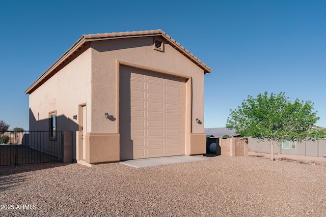 garage featuring fence