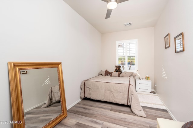 bedroom with ceiling fan and light wood-type flooring