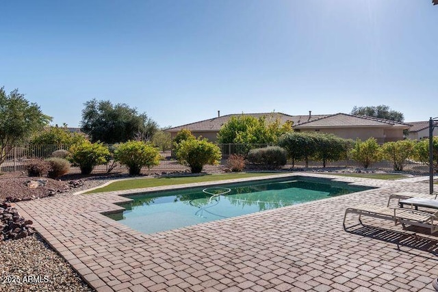 view of swimming pool with a patio area