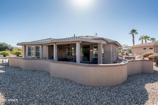 back of property featuring a patio