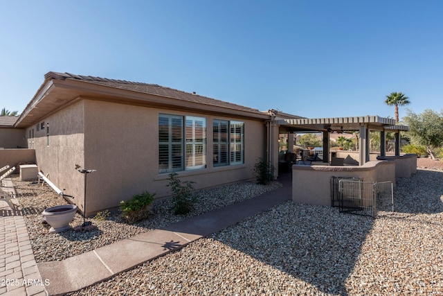 view of side of home featuring a patio