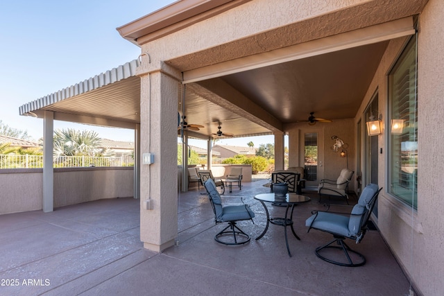 view of patio featuring an outdoor hangout area and ceiling fan