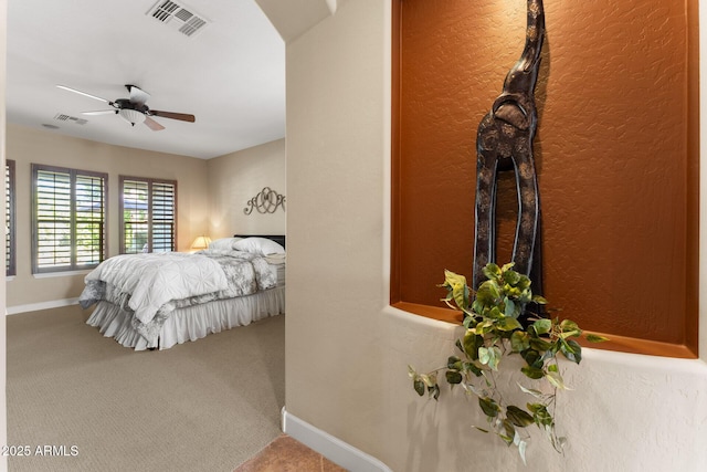 bedroom with ceiling fan and carpet