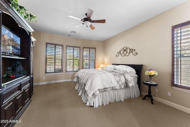 carpeted bedroom featuring ceiling fan