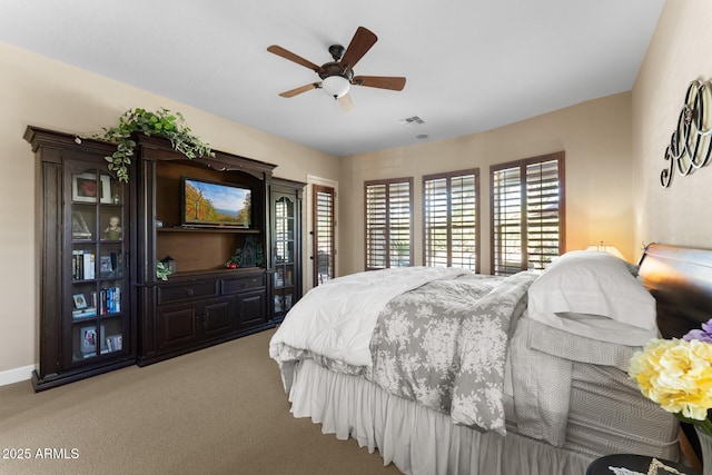 carpeted bedroom featuring ceiling fan