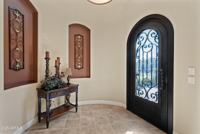 entrance foyer featuring light tile patterned flooring