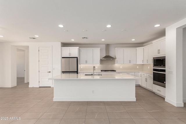 19434 S 212th Pl, Queen Creek, AZ 85142 - kitchen featuring appliances with stainless steel finishes, wall chimney exhaust hood, light tile patterned floors, a center island with sink, and recessed lighting