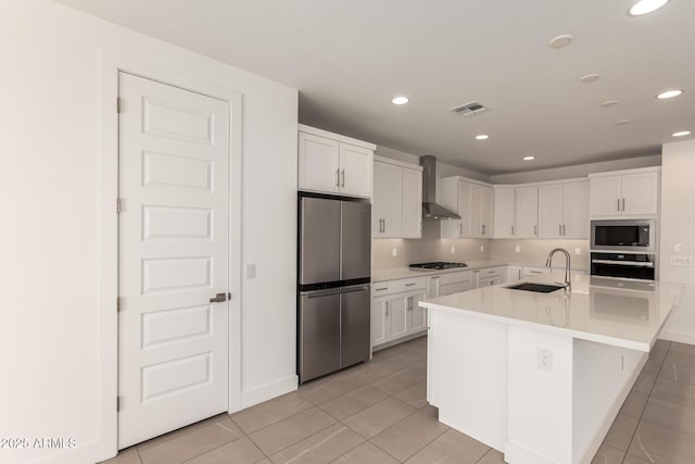 19434 S 212th Pl, Queen Creek, AZ 85142 - kitchen featuring appliances with stainless steel finishes, wall chimney exhaust hood, light tile patterned floors, white cabinets, and light countertops