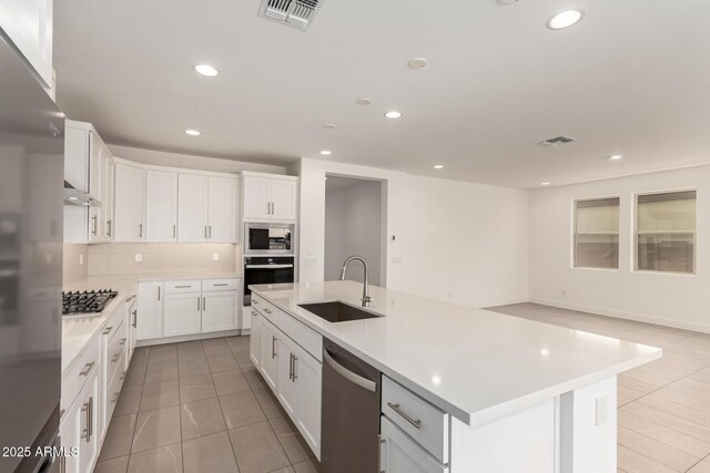 19434 S 212th Pl, Queen Creek, AZ 85142 - kitchen featuring appliances with stainless steel finishes, light tile patterned floors, under cabinet range hood, light countertops, and recessed lighting