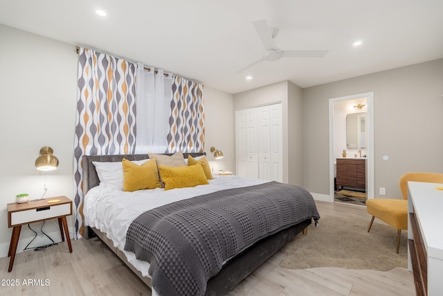 bedroom with recessed lighting, a closet, ceiling fan, ensuite bathroom, and light wood finished floors
