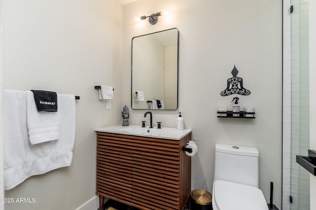 bathroom with toilet and vanity