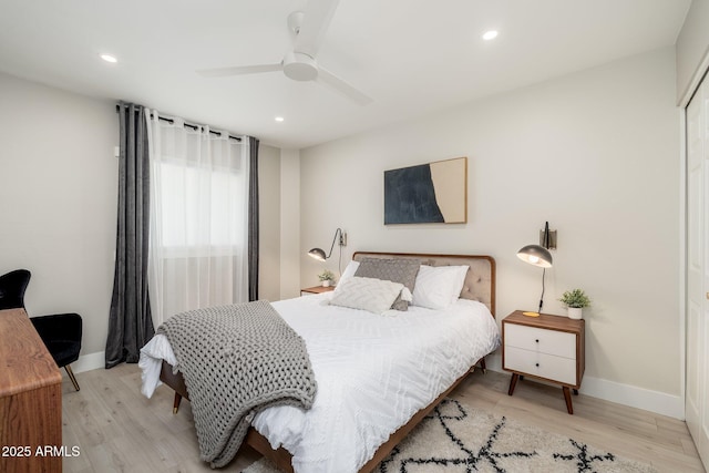 bedroom featuring recessed lighting and wood finished floors
