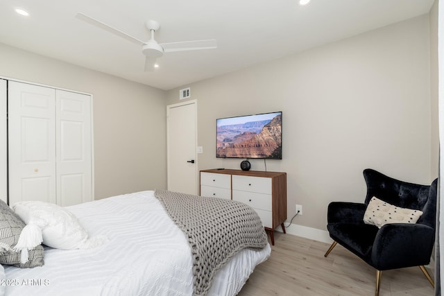bedroom featuring recessed lighting, a closet, light wood-type flooring, visible vents, and baseboards