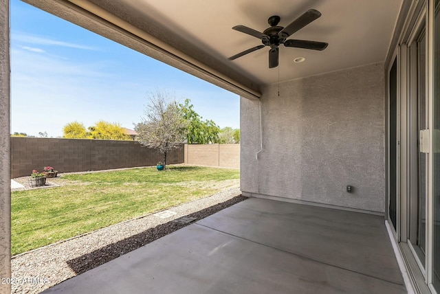 view of patio featuring a fenced backyard and a ceiling fan
