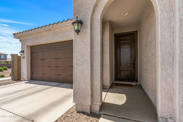 property entrance with stucco siding