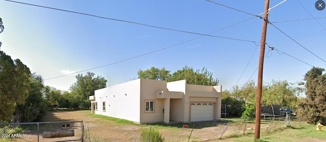 pueblo-style house featuring a trampoline