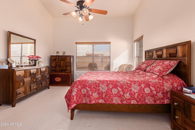 bedroom with high vaulted ceiling, light carpet, and ceiling fan