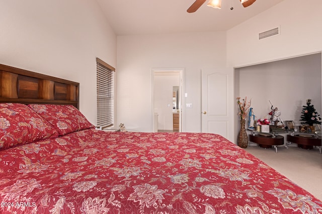 carpeted bedroom with ceiling fan, connected bathroom, and lofted ceiling