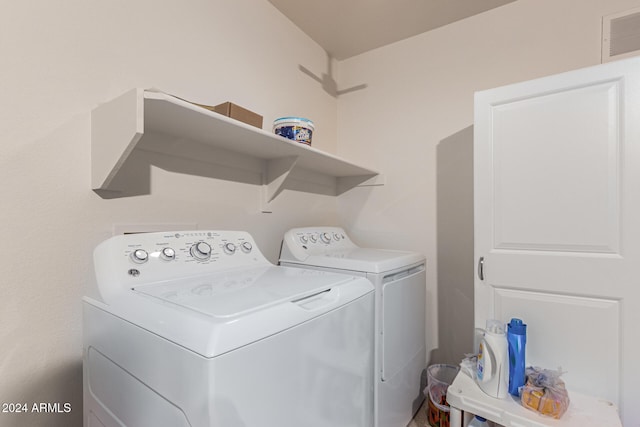 washroom with washer and clothes dryer