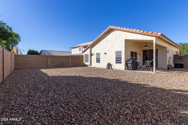 back of property featuring a patio and ceiling fan