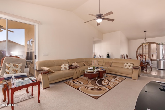 living room featuring carpet floors, lofted ceiling, and a healthy amount of sunlight