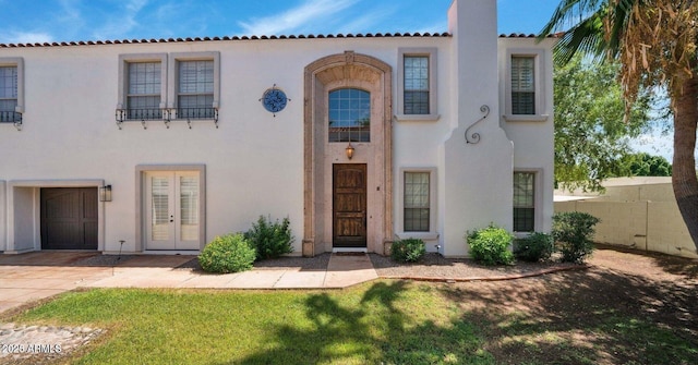 mediterranean / spanish house with a garage