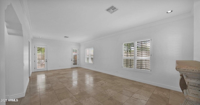 empty room featuring ornamental molding