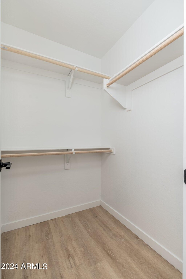 walk in closet featuring light wood-type flooring