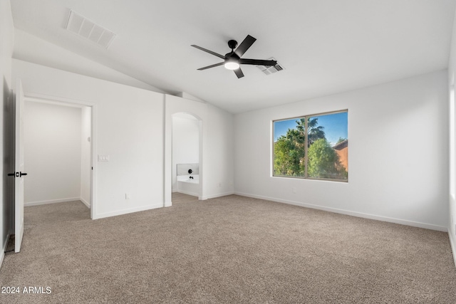 unfurnished bedroom with ceiling fan, light carpet, and vaulted ceiling