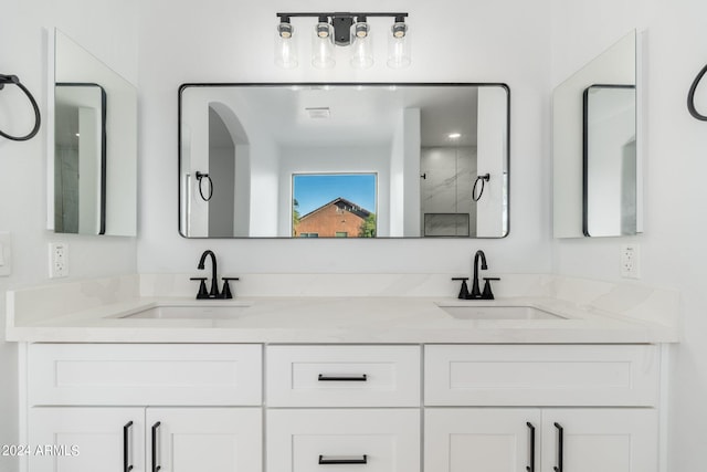 bathroom with vanity and walk in shower