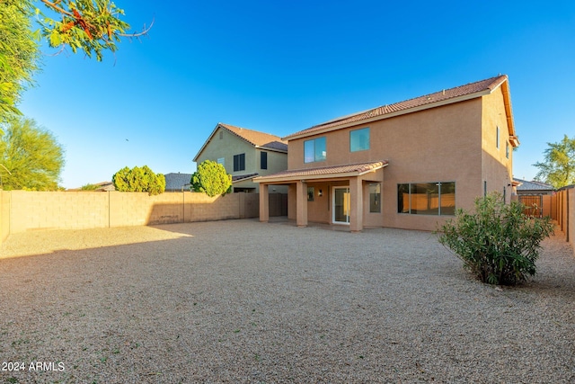 back of house featuring a patio