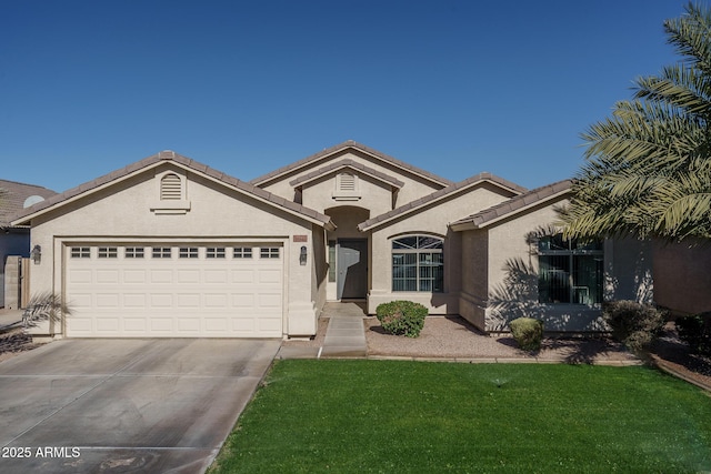 view of front of home with a front lawn and a garage