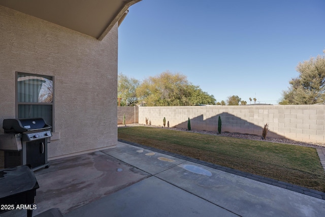 view of patio featuring a grill