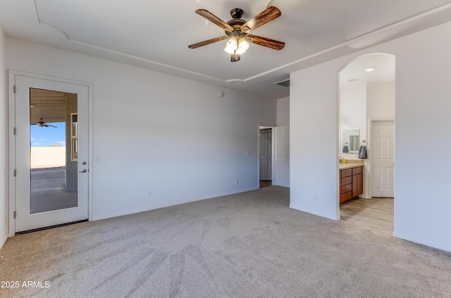 interior space with light colored carpet and ceiling fan