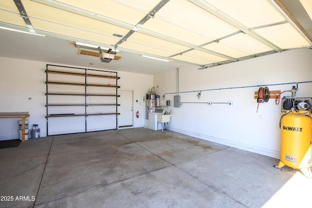 garage with a garage door opener, electric panel, and water heater