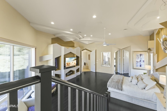 bedroom featuring beam ceiling, ceiling fan, and wood-type flooring